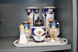 A selection of 20th-century Noritake porcelain ware, featuring hand painted floral decoration with