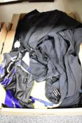 A carton of ex stock cycling attire including padded leggings and one piece lycra suits etc in a