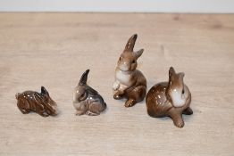 A group of four Beswick Pottery animal studies comprising 'Rabbit' (On Haunches) model number