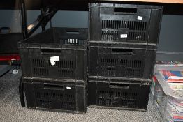 Five large plastic crates.