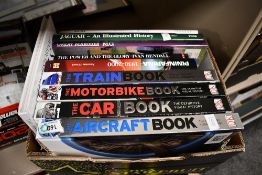 A small carton of automobilia themed books including Dorling Kindersley The Car Book, The Train Book