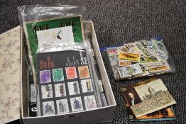 A small selection of stamp collectors packs, cigarette cards and a vintage copy of The Cup-50