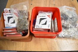 Two boxes and a bag of bicycle chains and links