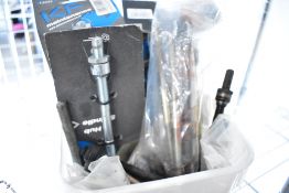 A box of various bike spindles (old new stock)