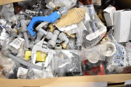 A large box of plumbing joints and tools