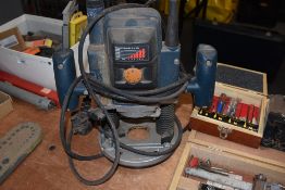 A Bosch PA6-GF35 Router and various router bits