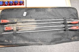 A fabric roll of four Forge steel extra long screwdrivers