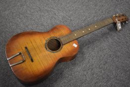 A vintage Harmony acoustic guitar, headstock label worn , no visible internal label