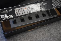 A Korg Toneworks AX1000G modelling signal processor guitar effects board , with original box