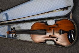 A traditional violin, unlabelled, probably 19th Century, having 14 inch two piece back with later