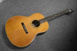 A Hohner (Gruhn design) acoustic guitar, includes vinyl gig bag, not stand