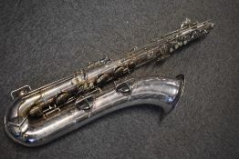 A vintage Conn 12M Crossbar Baritone Saxophone, serial number C15369, sold with original vintage