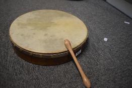 A traditional Bodhran and beater , labelled Malachy Kearns, diameter approx. 36cm