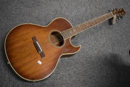 A Washburn Florentine acoustic guitar (electrics removed)
