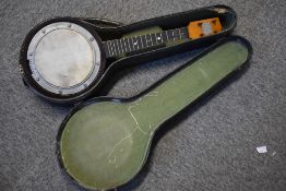 A vintage Swanee banjo ukulele , with crest to headstock, unstrung , cased (bridge in case)
