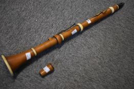 An early 19th Century boxwood and ivory clarinet, stamped Goulding and Co. Ivory exemption number