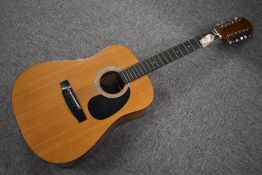 A Harmony twelve string acoustic guitar