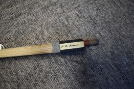 A traditional violin or cello bow, length approx. 62cm Marked PH London