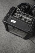 A Roland micro cube guitar practice amp