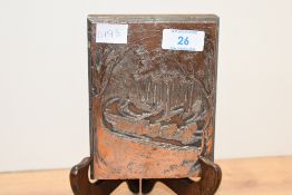 A vintage embossed relief copper panel depicting a horse-drawn cart travelling along a forest