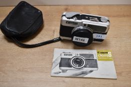 A Canon Demi S camera with Canon SH 30mm 1:1,7 lens in soft cover