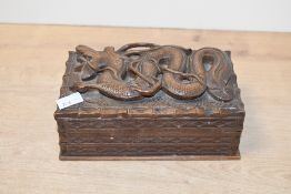 A early to mid 20th-century Chinese-style hardwood dragon box, featuring a detailed high relief