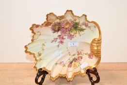 A late 19th-century Royal Worcester blush ivory shell-shaped dish, featuring hand painted floral