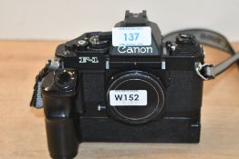 A Canon F-1 Camera body (292046) with a Canon AE power winder