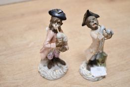 Two late 19th to 20th-century German Sitzendorf porcelain monkey band figurines, numbers 6 and 7,