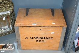 An early to mid 20th-century light wood box, featuring a hinged lid, metal exterior detailing and '