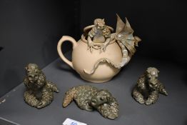 A vintage studio pottery decorative dragon teapot, featuring a softly blue glazed dragon emerging