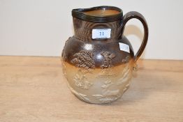 A late 18th-century Mortlake (Kishere) stoneware ewer, modelled in relief with various hunting