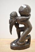 Of ethnographic interest, a mid to late 20th-century African hand carved hardwood sculpture,