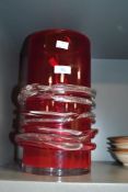 A large mid 20th-century art glass vase, featuring a vivid ruby red cased body wrapped in clear