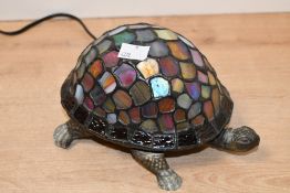 A vintage Tiffany-style turtle table lamp, featuring a sweetly formed metal turtle base with a