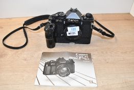 A Canon F-1 Camera body (172944) with a Canon AE motor Drive