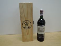 A 750ml bottle of Chateau Lafite Rothschild 2000 Pauillac, 12.5% vol with wooden presentation