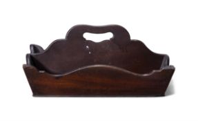A STAINED PINEWOOD CUTLERY TRAY, with shaped rim and handle, 18cm high to handle, 39cm long,