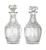 A RARE PAIR OF IRISH CUT GLASS ARMORIAL DECANTERS, CIRCA 1820, of club form, with lobed pumpkin