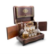 A NAPOLEON III BRASS-INLAID THUYA AND TULIPWOOD BANDED LIQUOR BOX, the serpentine shaped