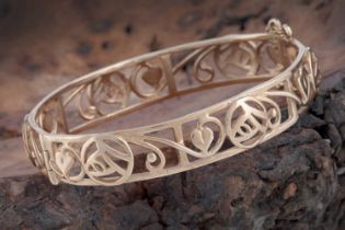A contemporary 9ct gold Charles Rennie Mackintosh inspired bangle