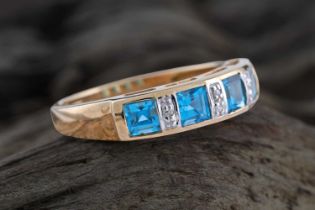 A contemporary London blue topaz and diamond ring