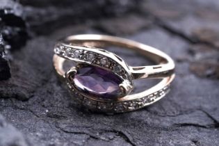 A contemporary amethyst and diamond dress ring