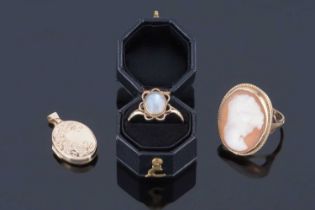 A modern 9ct gold and carved cameo ring; a moonstone ring; and a 9ct gold locket