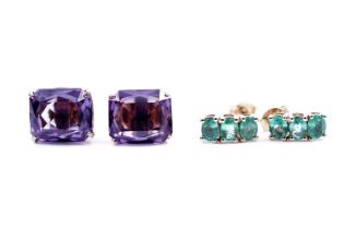 A pair of emerald stud earrings; and a pair of synthetic sapphire stud earrings