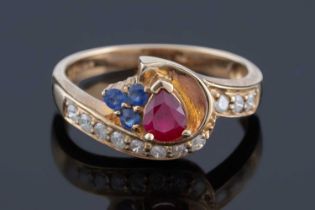 A sapphire, ruby, and diamond ring