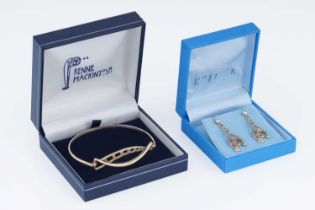A contemporary 9ct gold Charles Rennie Mackintosh inspired bangle and earrings