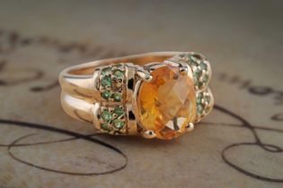 A contemporary citrine and green spinel dress ring