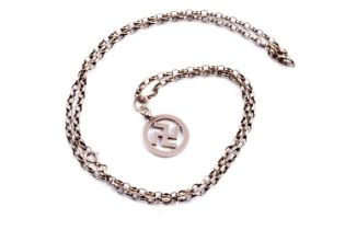 A 9ct gold swastika pendant, on a 9ct gold belcher-link chain