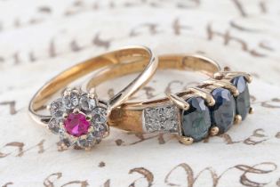 A contemporary three stone sapphire and diamond ring; and a flowerhead pattern ring